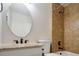 Cozy bathroom with a tan tile shower at 4760 S Wright Way, Morrison, CO 80465