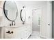 Stylish bathroom featuring dual sinks, granite counters, and a modern design at 4760 S Wright Way, Morrison, CO 80465