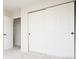 Bright bedroom with large closet doors, offering ample storage and a clean aesthetic at 4760 S Wright Way, Morrison, CO 80465