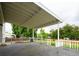 Large covered back deck offers outdoor living and dining space overlooking the backyard at 4760 S Wright Way, Morrison, CO 80465
