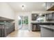 Well-designed kitchen featuring gray cabinets, stainless steel appliances and hardwood floors at 4760 S Wright Way, Morrison, CO 80465