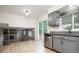 Stylish kitchen featuring gray cabinets, stainless steel appliances and hardwood floors at 4760 S Wright Way, Morrison, CO 80465