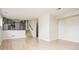 Living room with wood floors and a view of the stairs and kitchen at 4760 S Wright Way, Morrison, CO 80465