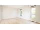 Bright and airy living room featuring wood flooring and large windows offering plenty of natural light at 4760 S Wright Way, Morrison, CO 80465