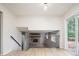 Bright living room with wood floors, staircase and access to the outdoor deck at 4760 S Wright Way, Morrison, CO 80465