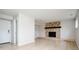 Spacious living room features a modern fireplace and neutral paint colors at 4760 S Wright Way, Morrison, CO 80465
