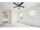 Bright bedroom with a ceiling fan and an ensuite bathroom at 4760 S Wright Way, Morrison, CO 80465