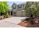 Charming two-story home with a well-manicured front yard and a spacious driveway leading to a two-car garage at 20182 E Maplewood Pl, Centennial, CO 80016