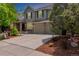 Charming two-story home with well-maintained landscaping, a three car garage and a manicured lawn at 20182 E Maplewood Pl, Centennial, CO 80016