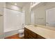 Bright bathroom featuring modern fixtures, a shower-tub combo and a spacious vanity with countertop at 8421 Galvani Trl # E, Littleton, CO 80129