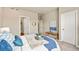 Bedroom with neutral colors, large windows, and bench seating at 8421 Galvani Trl # E, Littleton, CO 80129