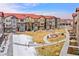 Scenic view of townhomes, showcasing well-manicured lawns, walking paths, and a central community space at 8421 Galvani Trl # E, Littleton, CO 80129