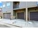 Row of multi-car garages in a modern community at 8421 Galvani Trl # E, Littleton, CO 80129