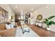 Open-concept living room showcasing contemporary furnishings and hardwood floors at 8421 Galvani Trl # E, Littleton, CO 80129