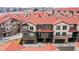 An aerial view of the townhomes with private garages and balconies, highlighting the community's design at 8421 Galvani Trl # E, Littleton, CO 80129