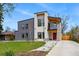 Contemporary two-story home with a sleek design, modern architectural details, and appealing landscaping at 1220 S Elm St, Denver, CO 80246