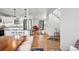 Open concept living room with hardwood floors and bright natural light at 1220 S Elm St, Denver, CO 80246