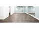 Finished basement with light blue walls, mirror, and durable flooring at 5586 Colorow Dr, Morrison, CO 80465