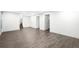 Spacious finished basement with durable flooring, neutral paint, and ample room for activities at 5586 Colorow Dr, Morrison, CO 80465