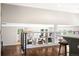 Bright living room with hardwood floors, modern shelving, and an open floor plan at 5586 Colorow Dr, Morrison, CO 80465