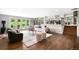 Bright living room with hardwood floors, modern furniture, and outdoor access at 5586 Colorow Dr, Morrison, CO 80465