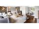 Cozy living area showcasing hardwood floors and decorative elements with seamless flow into adjacent rooms at 5586 Colorow Dr, Morrison, CO 80465