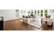 Bright living room with hardwood floors, modern furniture, and natural light at 5586 Colorow Dr, Morrison, CO 80465