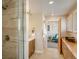 Bathroom featuring glass shower and vanity with storage, adjacent to sitting room at 1231 Cedar Ave, Boulder, CO 80304