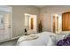 Bright bedroom featuring a private balcony, neutral tones, and doorway into sitting room at 1231 Cedar Ave, Boulder, CO 80304