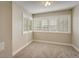 Inviting bedroom with large windows, neutral carpet, and ample natural light at 1231 Cedar Ave, Boulder, CO 80304