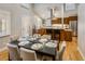 Open concept dining room flows into the kitchen featuring hardwood floors and modern finishes at 1231 Cedar Ave, Boulder, CO 80304