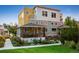 Stunning multi-story home featuring a covered front porch, a mix of modern colors, and professional landscaping at 1231 Cedar Ave, Boulder, CO 80304