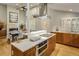 Gourmet kitchen featuring stainless steel appliances, white countertops, wood cabinetry, and an open layout at 1231 Cedar Ave, Boulder, CO 80304