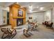 Warm and inviting lounge area with a stone fireplace, comfortable seating, and soft lighting at 1231 Cedar Ave, Boulder, CO 80304