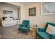 Comfortable sitting area in the main bedroom featuring stylish armchairs and plenty of natural light at 1231 Cedar Ave, Boulder, CO 80304