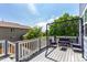 Cozy back deck with string lights and outdoor seating for relaxing and entertaining with views of the neighborhood at 6694 E 129Th Ave, Thornton, CO 80602