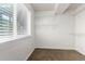 Walk-in closet with shelving, offering ample storage and organization space in a bright, naturally lit room at 6694 E 129Th Ave, Thornton, CO 80602