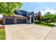 Charming two-story home featuring a three car garage, brick accents, and landscaped yard at 6694 E 129Th Ave, Thornton, CO 80602