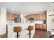 Bright kitchen with modern stainless appliances, white subway tile backsplash, and breakfast bar seating at 6694 E 129Th Ave, Thornton, CO 80602