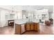 Bright kitchen and breakfast nook area illuminated by natural light, featuring wood floors and modern decor at 6694 E 129Th Ave, Thornton, CO 80602
