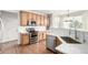 Modern kitchen featuring stainless steel appliances, quartz countertops, and ample cabinet space at 6694 E 129Th Ave, Thornton, CO 80602