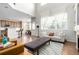 Bright living room offering an open-concept layout with kitchen and dining area views at 6694 E 129Th Ave, Thornton, CO 80602
