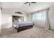 Bedroom with large bed, mountain-themed wall decor, carpet, and plenty of natural light at 6694 E 129Th Ave, Thornton, CO 80602