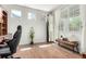 Bright office space featuring hardwood floors, sunlit windows and modern furniture at 6694 E 129Th Ave, Thornton, CO 80602