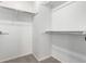 Walk-in closet with shelving and bars for clothing organization at 6694 E 129Th Ave, Thornton, CO 80602
