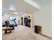 Large finished basement with TV, treadmill, and seating area at 1576 S Ursula Ct, Aurora, CO 80012