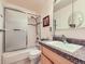 Bathroom with granite vanity, tub-shower, and ample storage at 1576 S Ursula Ct, Aurora, CO 80012