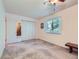 This bedroom has a ceiling fan, window, and triple-door closet at 1576 S Ursula Ct, Aurora, CO 80012