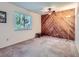 This bedroom has a striking wood paneled accent wall at 1576 S Ursula Ct, Aurora, CO 80012