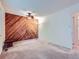 Bedroom featuring a wood paneled accent wall and ceiling fan at 1576 S Ursula Ct, Aurora, CO 80012